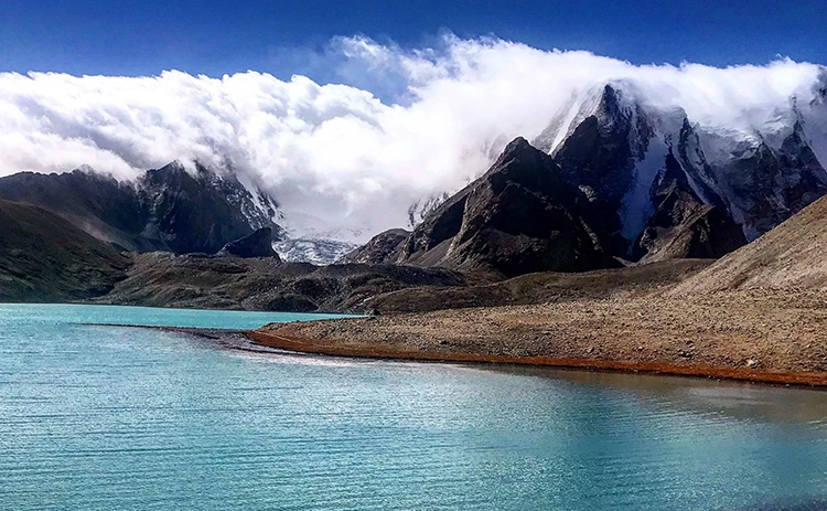 Experience peace and stunning views at Lachen and Gurudongmar Lake, a serene gem in Sikkim.